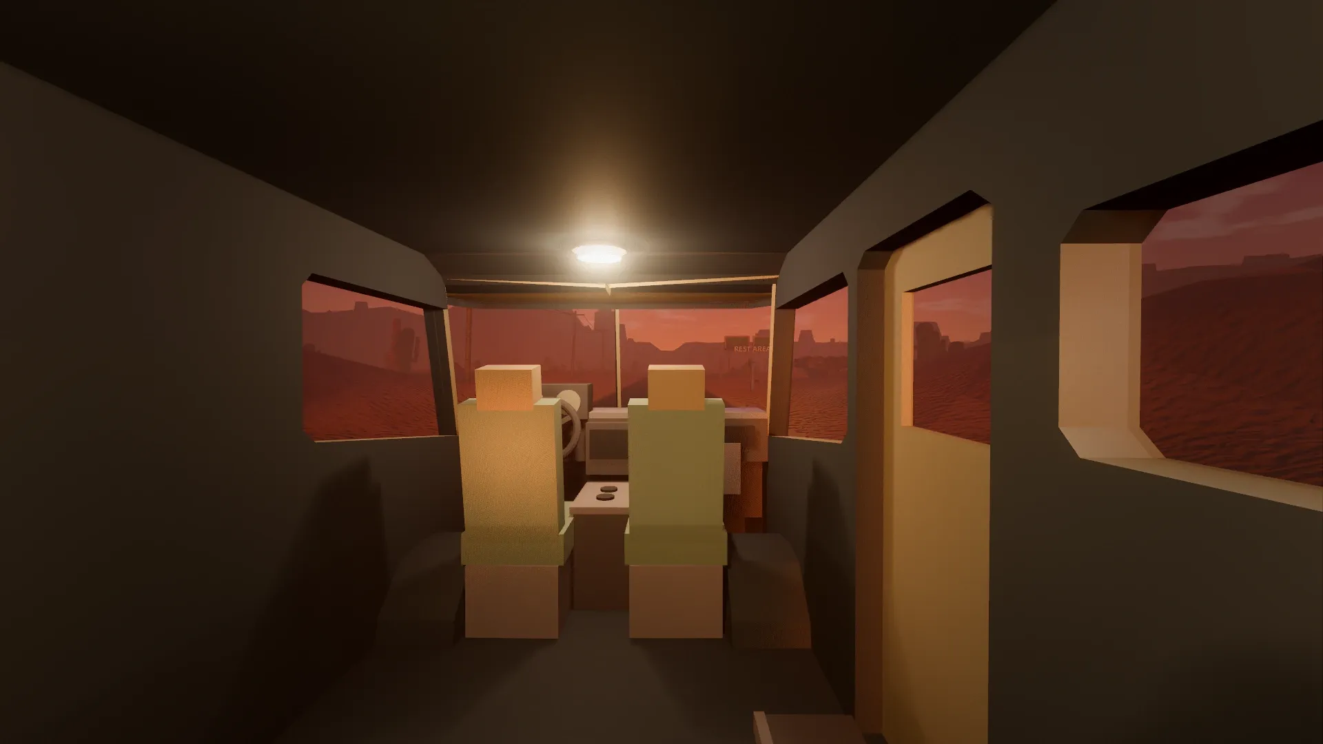 Inside the camper, looking forward through the cab at the desert