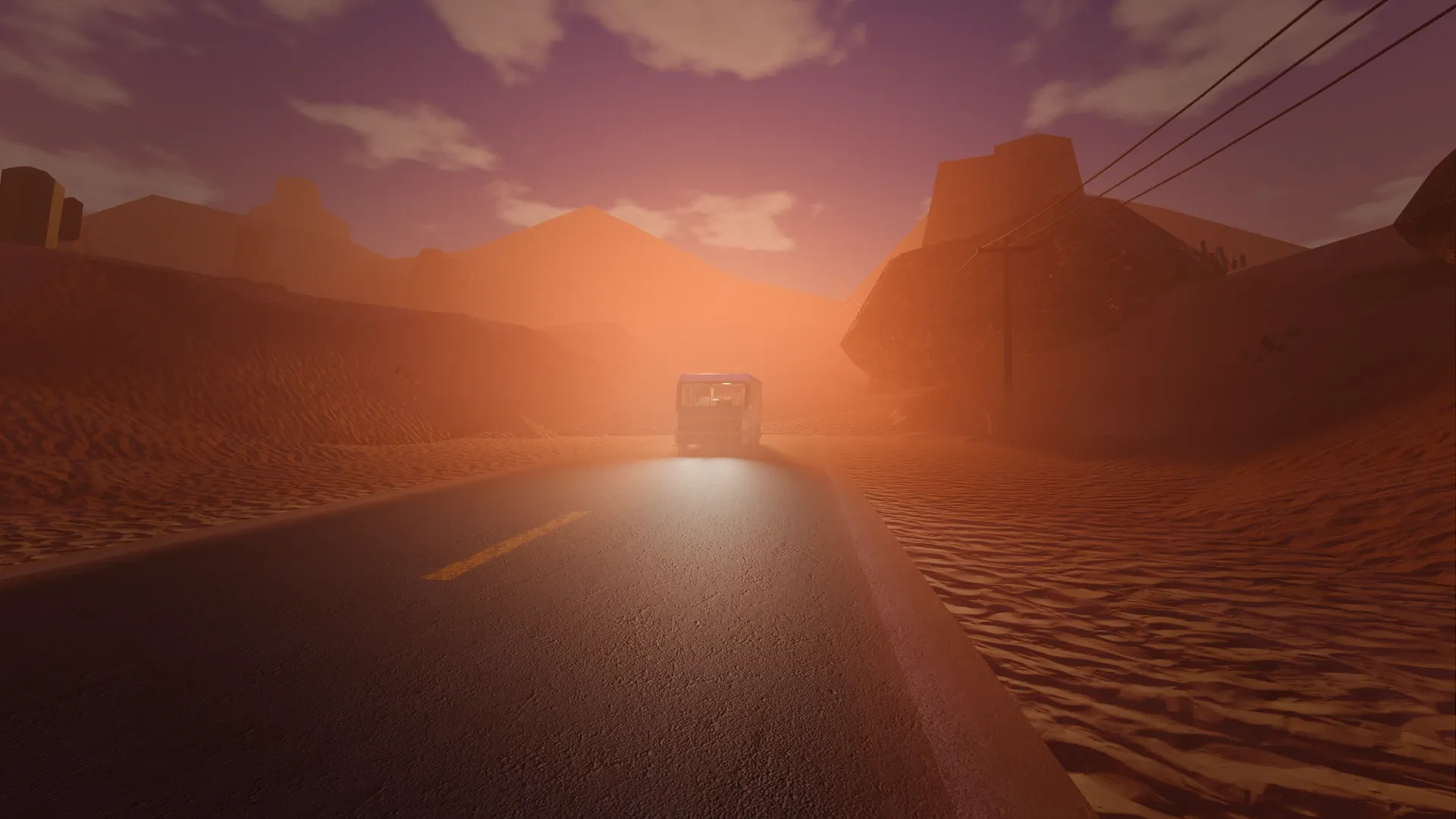 The camper's headlights cutting through dusty haze on a desert highway between mesas